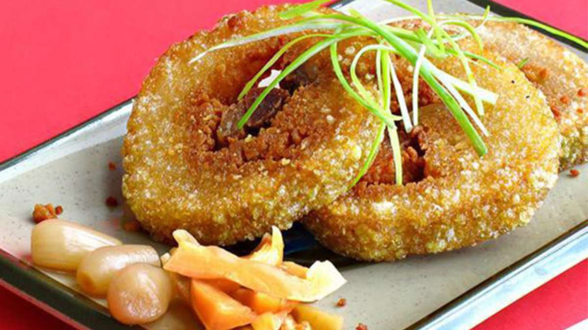 Chung cake is traditionally served with pickled vegetables and can be enjoyed fresh or pan-fried until golden brown for a crispy exterior